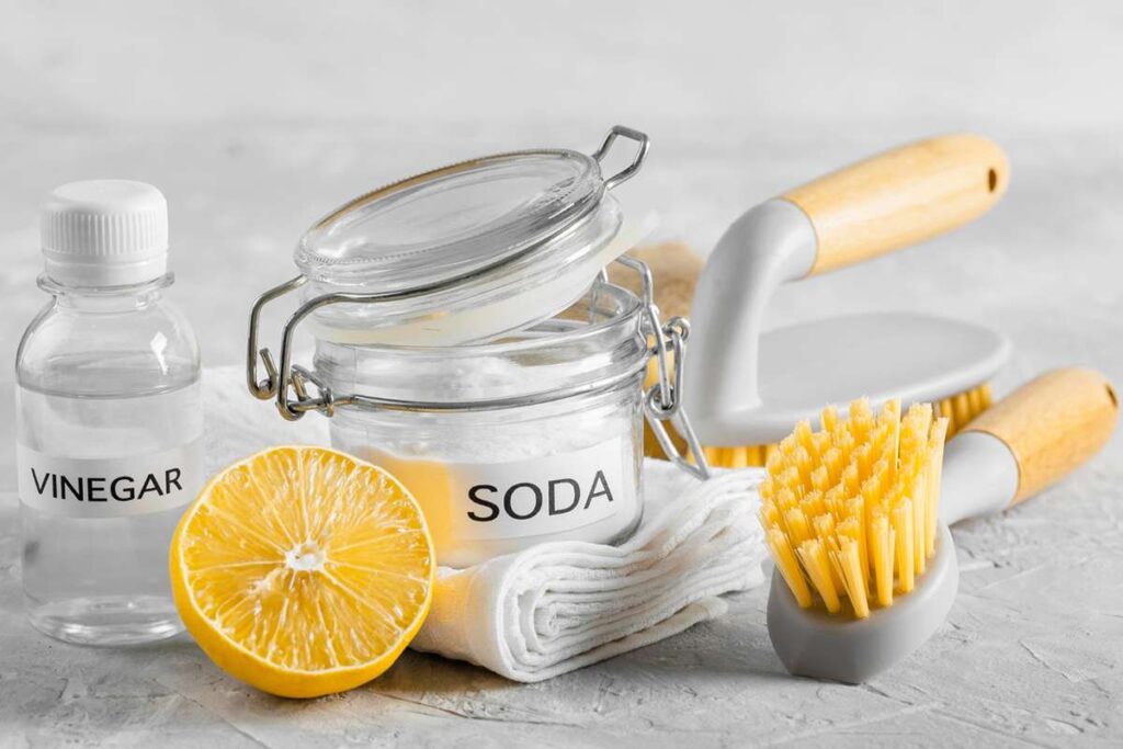 Cleaning faucet parts using vinegar and brush