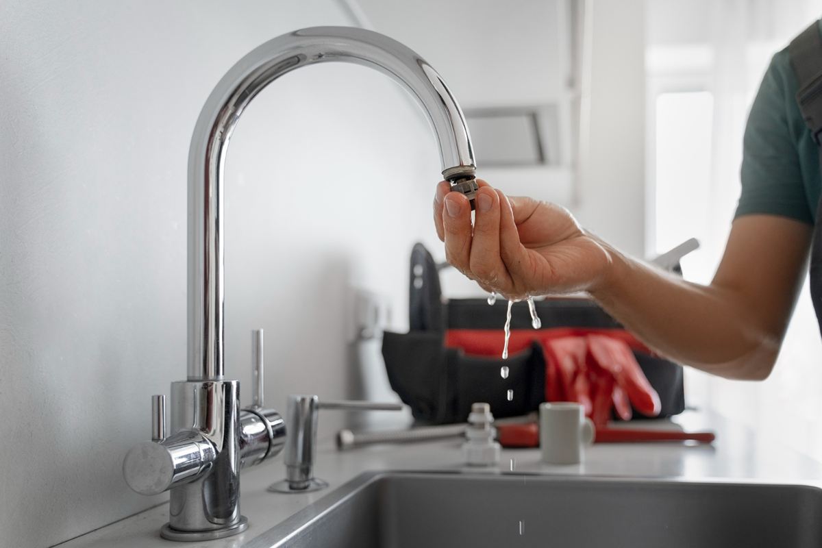 Stainless hand sink installed in a commercial kitchen