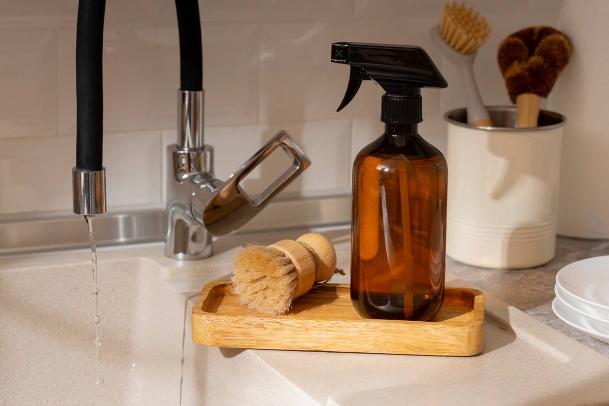Copper sink cleaning with natural ingredients like lemon, salt, and baking soda
