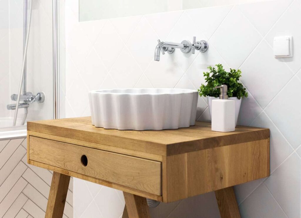 Rustic sink vanity made of reclaimed wood in farmhouse bathroom