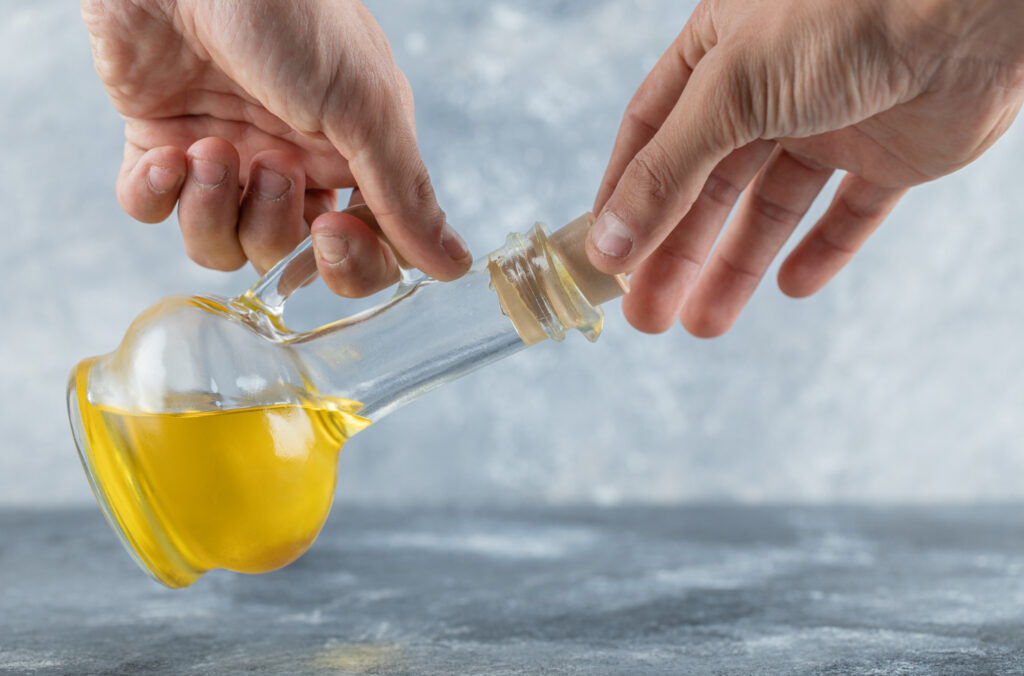 Safe cooking oil disposal using a sealed container