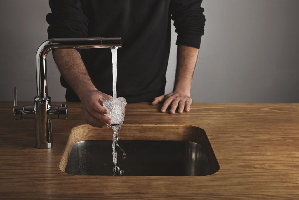 Glass filled with bathroom sink water