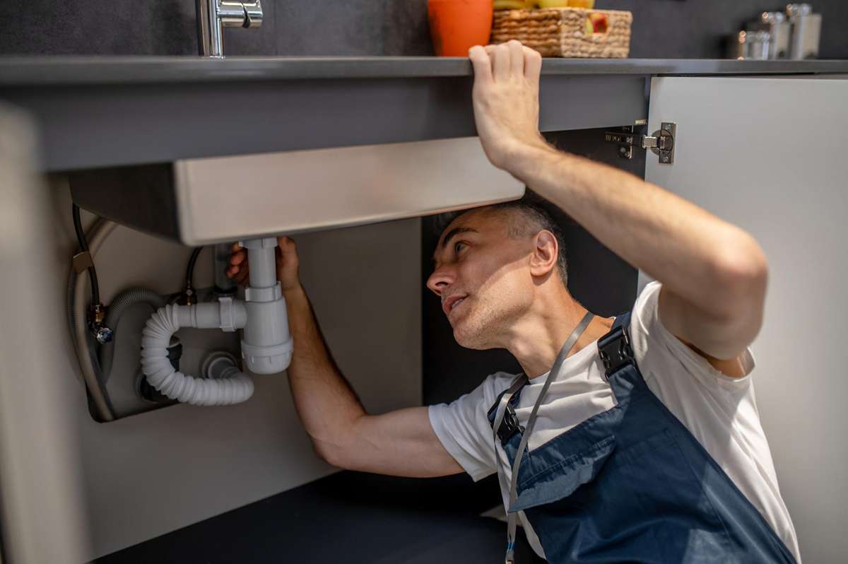 Removing kitchen faucet handle with screwdriver